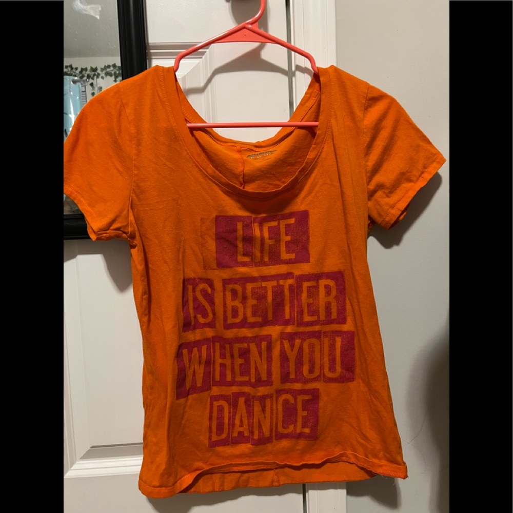 Orange shirt with writing on it